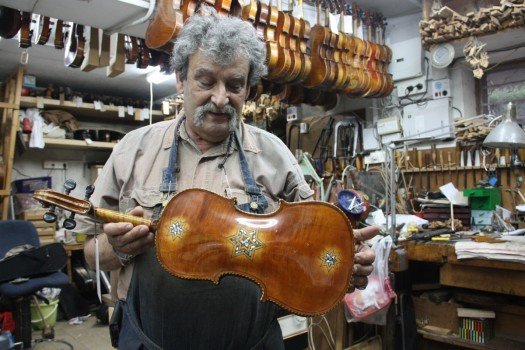 Amnon Weinstein with a restored Star of David violin