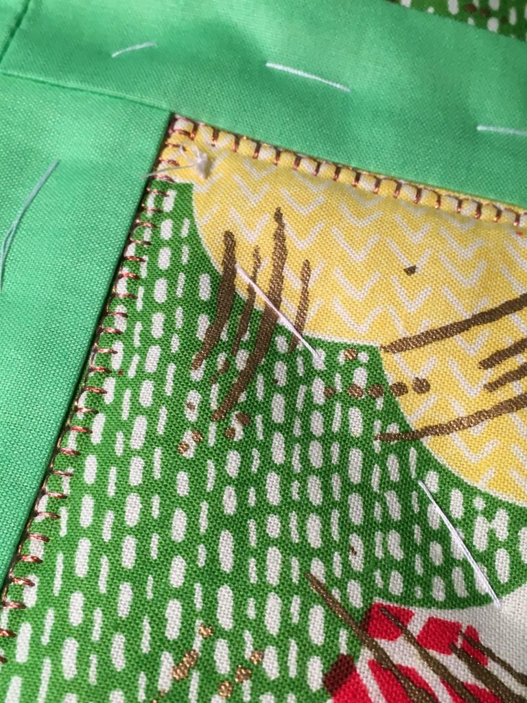 Bright Delight machine blanket stitching with copper metallic thread